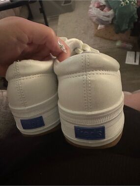 Keds White Low Top Sneakers with Blue Heel Logo